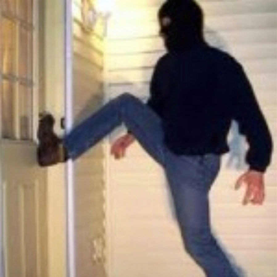 Burglar kicking in door 